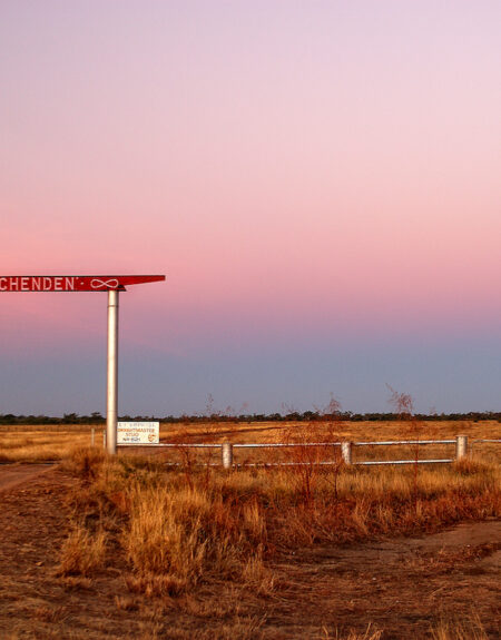 Hughenden Station sign at Sunset